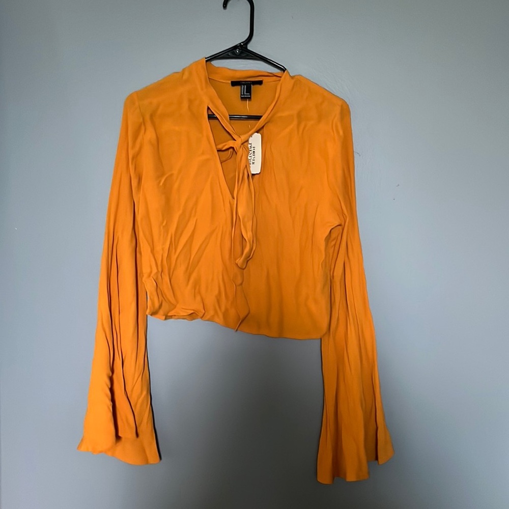 never worn crop top from forever 21. mustard color , wide sleeve